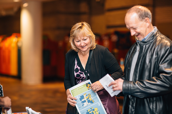 woman and man reading a map at an event