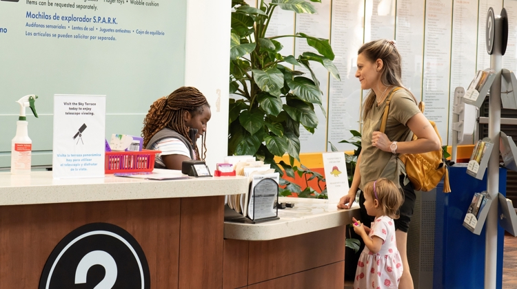 Woman and child at info desk