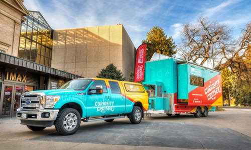 Curiosity Cruiser and the truck in front of the Museum