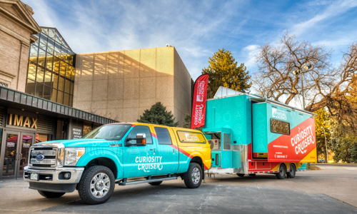 Curiosity Cruiser and the truck in front of the Museum