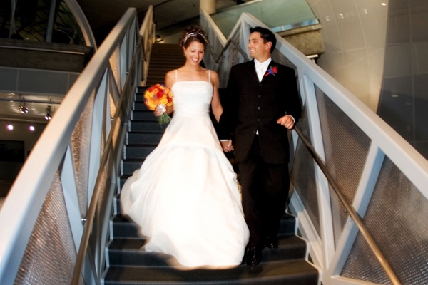 A bride and groom on the stairs 