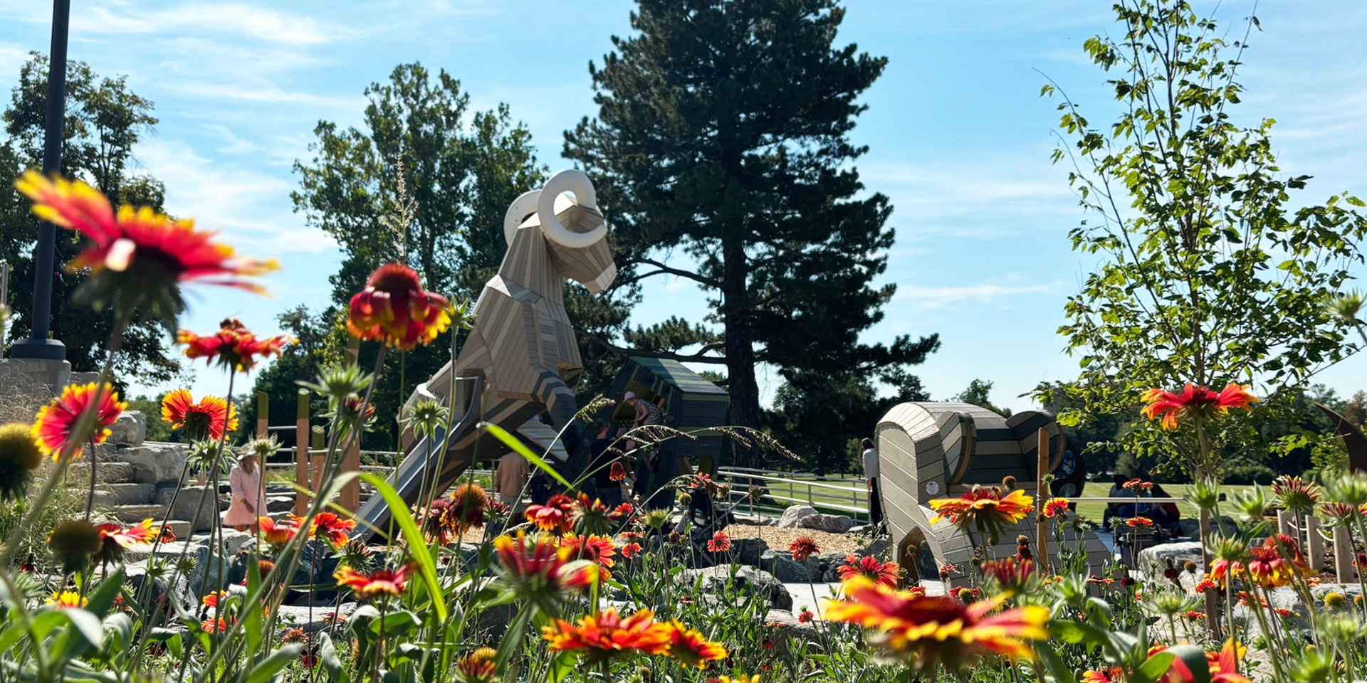 Flowers blooming in foreground; Ram structure in background