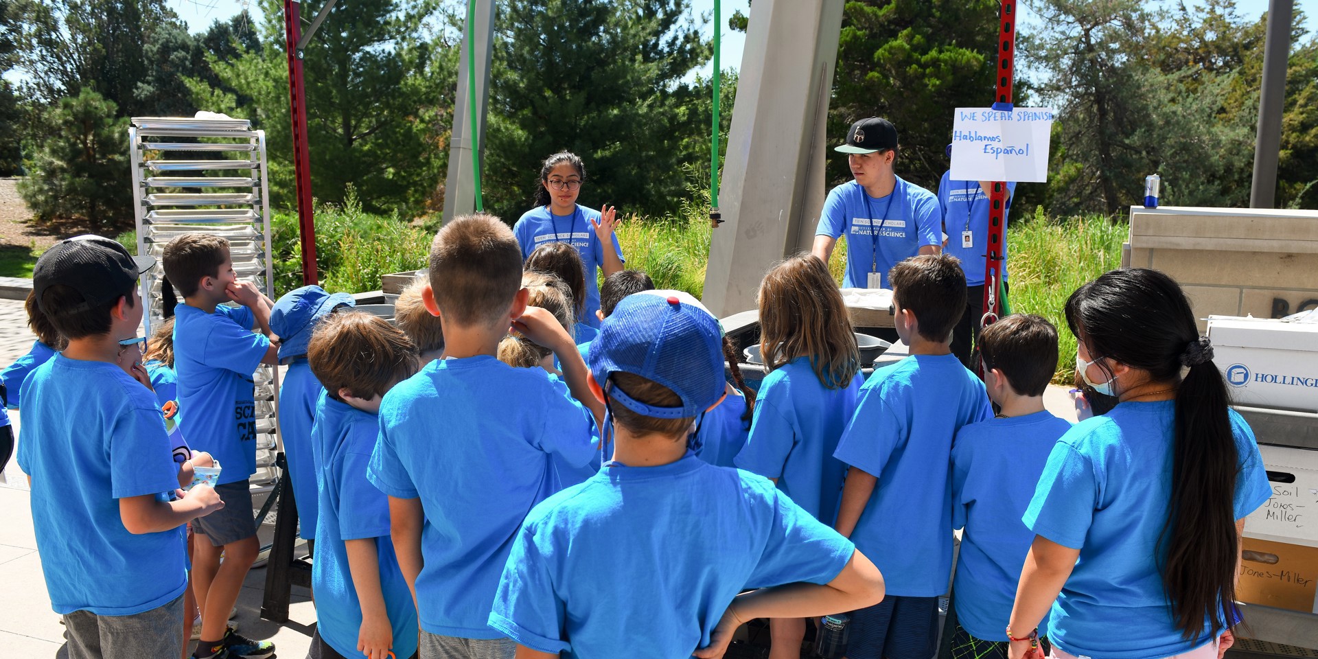 A class of campers meet Teen Science Scholars presenting their summer research findings