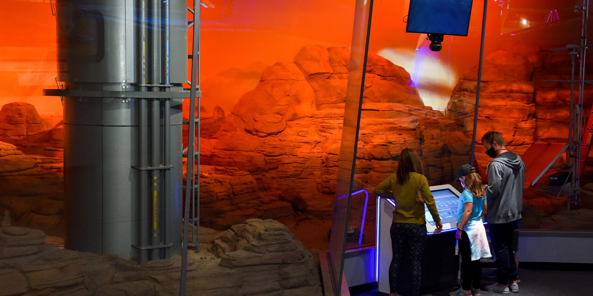 Guests Standing In Front Of The Mars Diorama